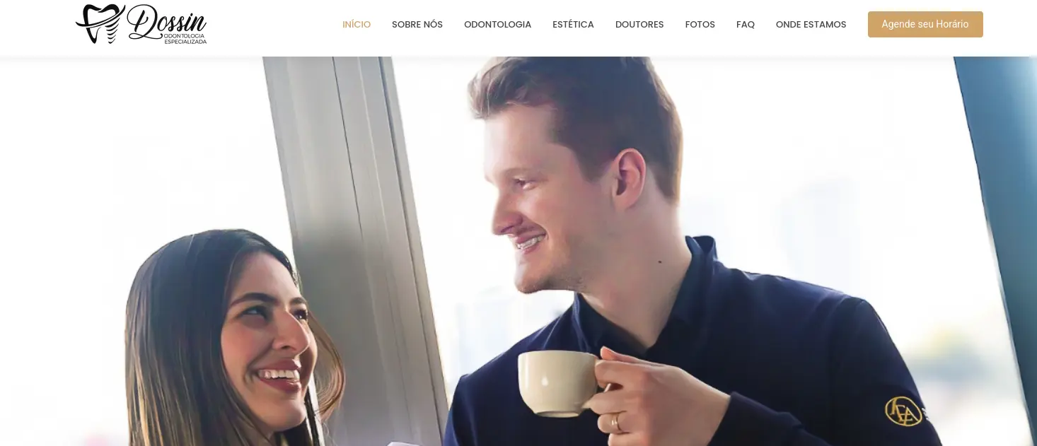 A rubber duck in a green field with a small pond and blue sky.